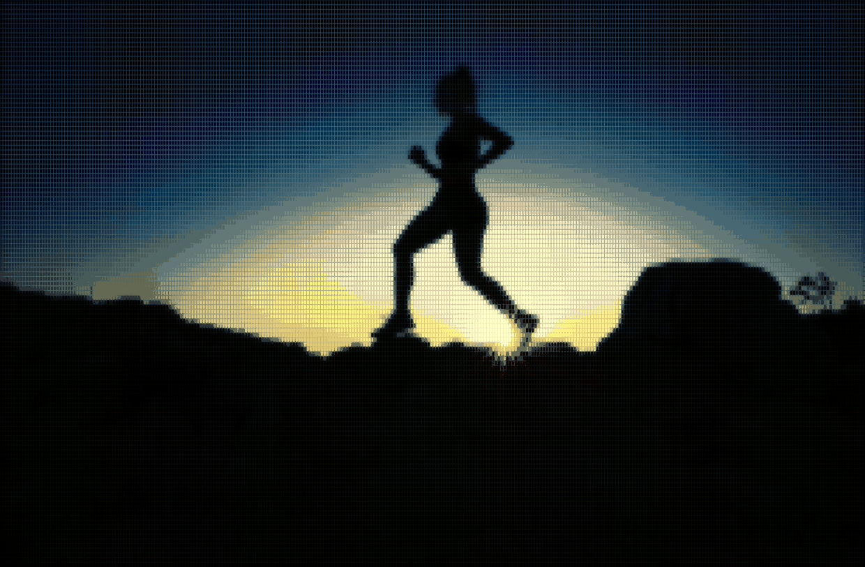 A runner silhouetted against a low sun